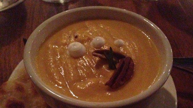 Butternut squash soup with toasted pecans and sour cream. | Nancy Stiles