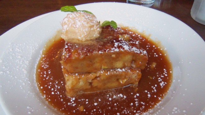 "Remy's Warm Apple and Golden Raisin Bread Pudding" with brandy sauce.