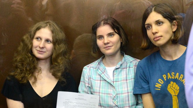 The members of Pussy Riot show the court's verdict, which led to their sentencing to two years in prison.