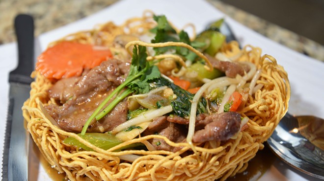 Pan fried egg or rice noodles are served with different forms of protein, such as beef pictured.