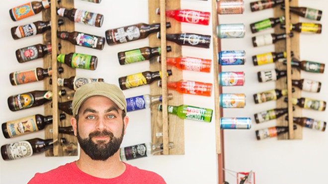 Co-owner Brendon Maciariello in front of the restaurant's extensive bottle selection.