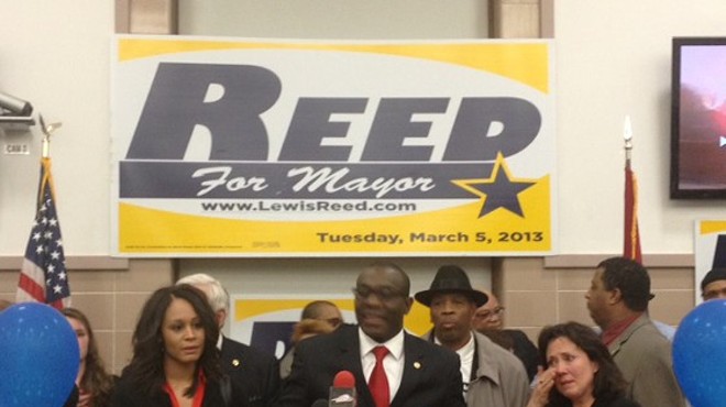 Lewis Reed with his wife, Mary Entrup (right), in 2013.