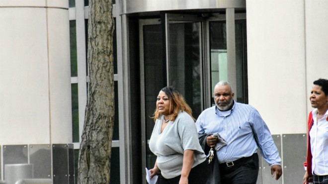 Former St. Louis Police Office Terri Owens (left) leaves federal  court on Tuesday with her family.