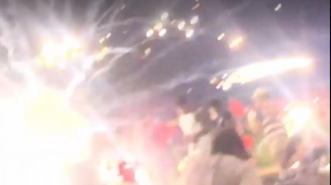 A mortar shell explodes in front of a Webster Groves crowd, captured on video.