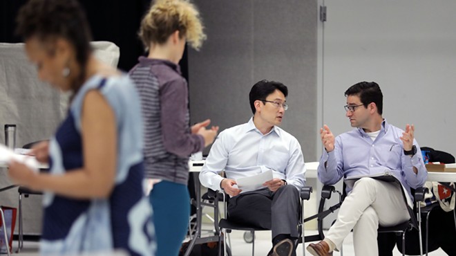 From left, doctors Albert Kim and Eric Leuthardt discussing BrainWorks.