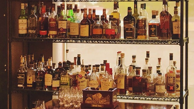 Whiskey, scotch, bourbon, rye and more line the shelves at (IN)Famous Bar inside The Wine & Cheese Place in Clayton.