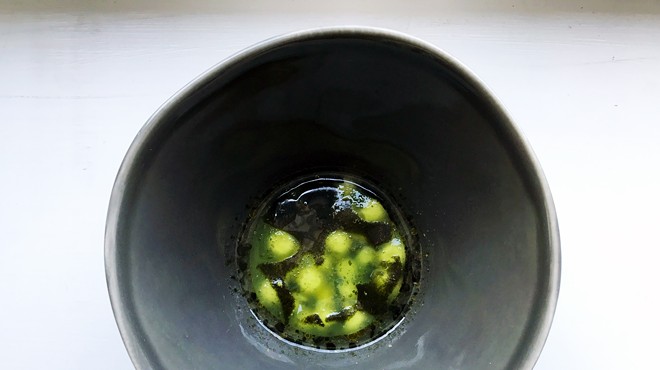 At Logan Ely's Savage, a dish of crispy tofu spheres made with blended scorpions paired with raw jicama spheres and served with a cucumber jelly, toasted nori oil and green tomato juice.