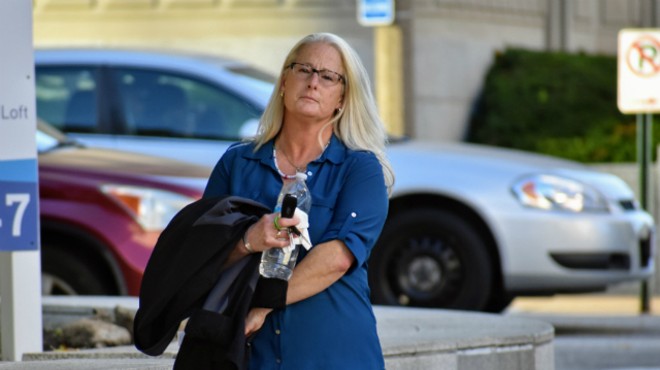 Ex-St. Louis police officer Lori Wozniak leaves court on Tuesday.