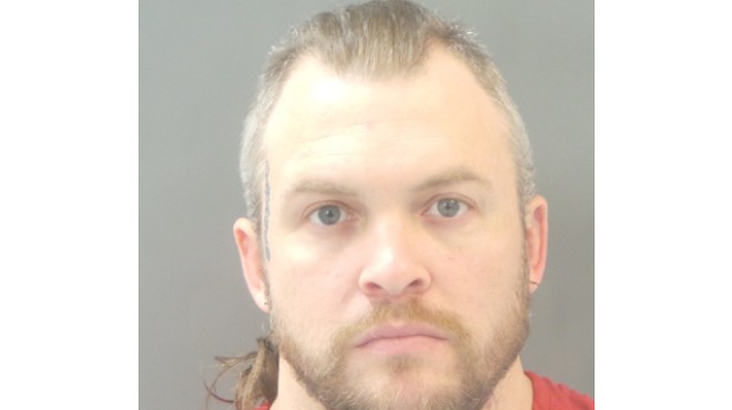 Justin Neilson's booking photo prior to his arrest last October.