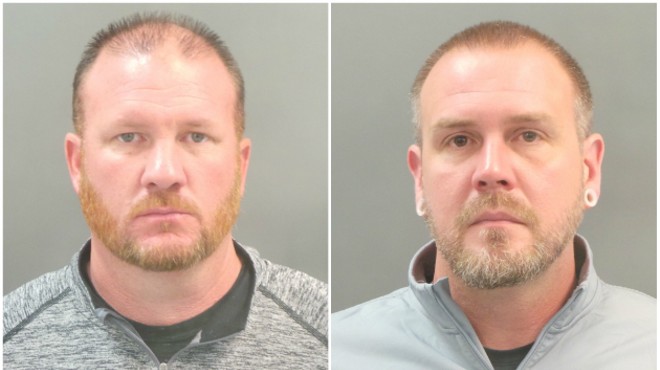 St. Louis police officers Brian Jost (L) and Michael Langsdorf were among four cops charged with forgery and stealing.