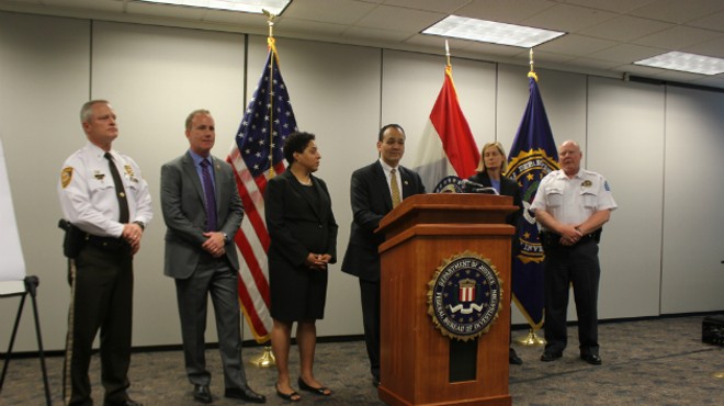 FBI Special Agent in Charge William Woods (center) and members of Mission SAVE announce indictments of alleged gang members.