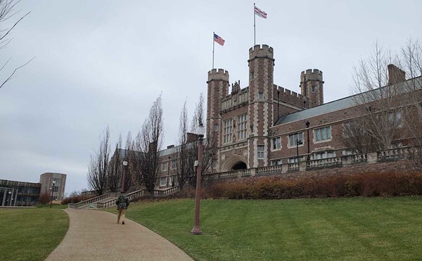 More than 100 Washington University faculty and staff have signed a letter calling on the administration to reverse the suspensions of three student protesters.