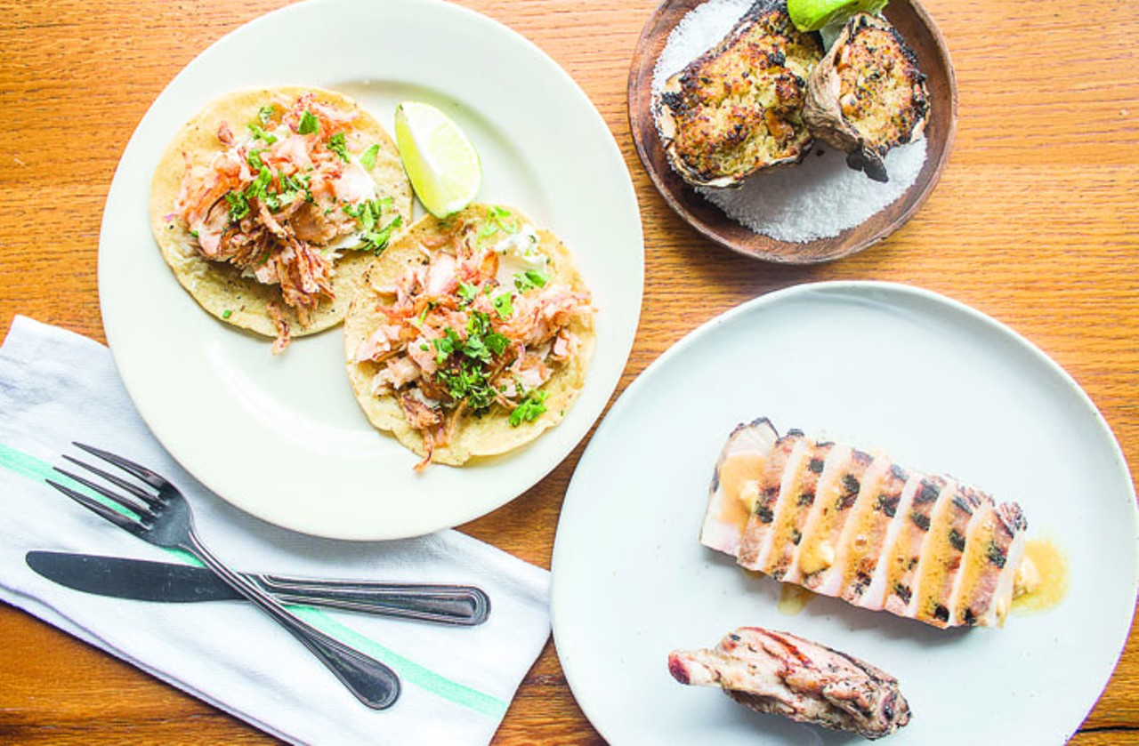 Best New Restaurant: P&uacute;blico Is there any culinary concept Mile Randolph can't nail &#151; Half & Half for breakfast, the Good Pie for pizza, Little Country Gentleman for tasting menus? Add to that list P&uacute;blico, his pan-Latin American restaurant that has been St. Louis' clear dining highlight of 2015. P&uacute;blico elevates Central and South American cooking to levels far beyond anything we've seen in this town &#151; or perhaps in any other town, save for something on the level of Rick Bayless' revered Topolobampo in Chicago. Randolph's menu is ambitious &#151; baby octopus served swimming in a caper- and paprika-spiked tomato sauce, sweetbreads simmered with pineapple and habanero, rice pudding topped with shaved foie gras torchon &#151; though dishes like the grilled whole fish or the perfectly cooked bone-in pork chop prove he is equally comfortable with less-showy preparations. It's not just the food that makes P&uacute;blico so special. The bar program here is second to none, and the renovated storefront's good looks (designed by SPACE Architecture + Design) are as stylish as it gets in this city. This place is a winner in every regard. (Pictured: An array of dishes at this year&#146;s best new restaurant, P&uacute;blico. Photo by Mabel Suen.) 6679 Delmar Boulevard, University City, 63130. 314-833-5780, www.facebook.com/publicostl.