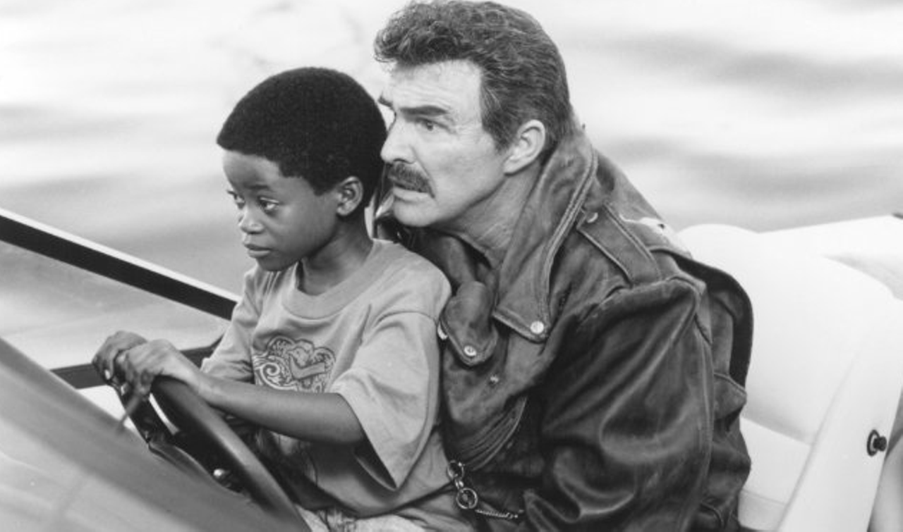Cop and a Half  (1993)
Ironically adored by anyone older than 8 who also doesn't have children, Cop and a Half stars Burt Reynolds and Norman D. Golden III, a precocious boy who adorably proclaims: "I'm your worst nightmare: an eight-year-old with a badge!"