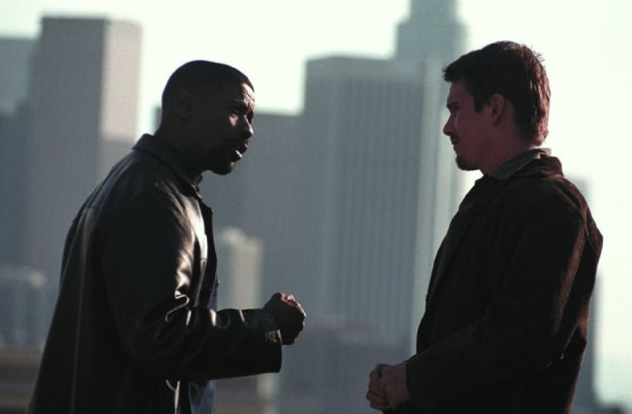 Training Day (2001)
The anti-buddy cop film, Antoine Fuqua's Training Day essentially shows Denzel Washington's Detective Alonzo Harris torture and eventually try to kill Ethan Hawke's Jake Hoyt over the course of its two hours. This is one of the rare police-partner films to earn an Academy Award (Washington for Best Actor). We're already suspicious that Washington's Harris is extremely dangerous before he says to Hawke, "Didn't know you liked to get wet, dog."