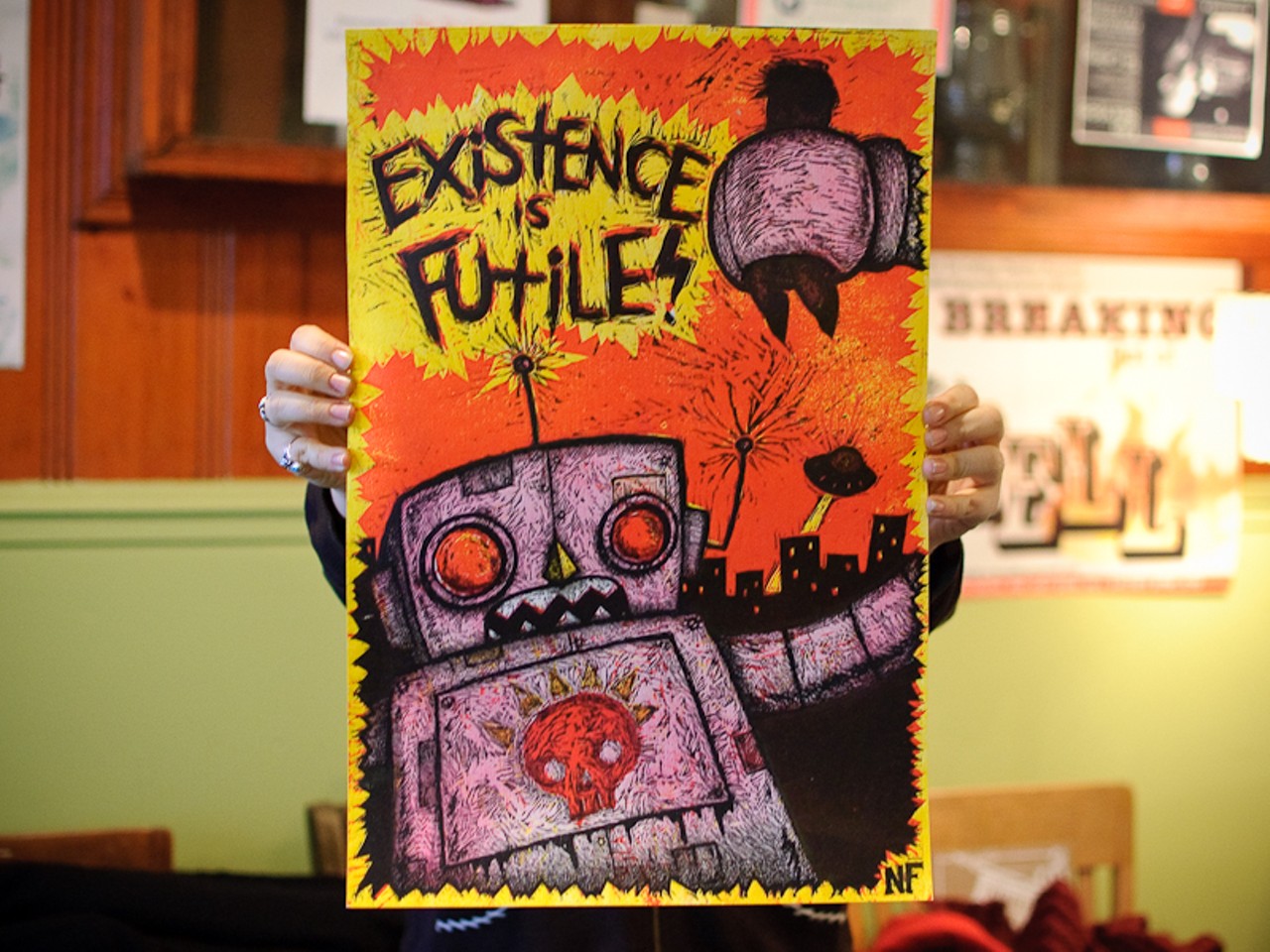Perhaps Nick Francel&rsquo;s &ldquo;Existence is Futile&rdquo; print was conceived as a counterpoint to Maggie Filla&rsquo;s &ldquo;Peace-Bot,&rdquo; or perhaps it was just a coincidence they were both for sale on Saturday.