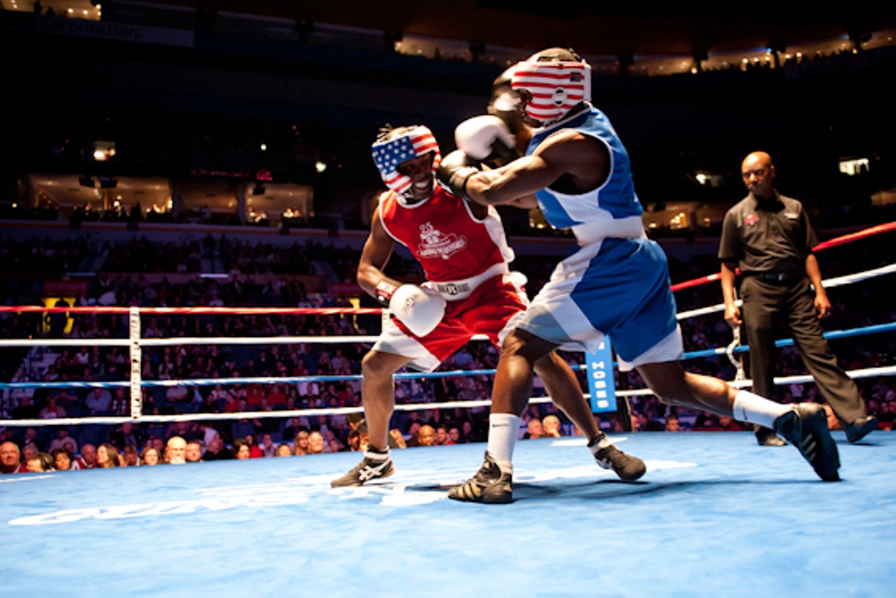 Cops and firefighters trading punches for charity at Guns 'N' Hoses.