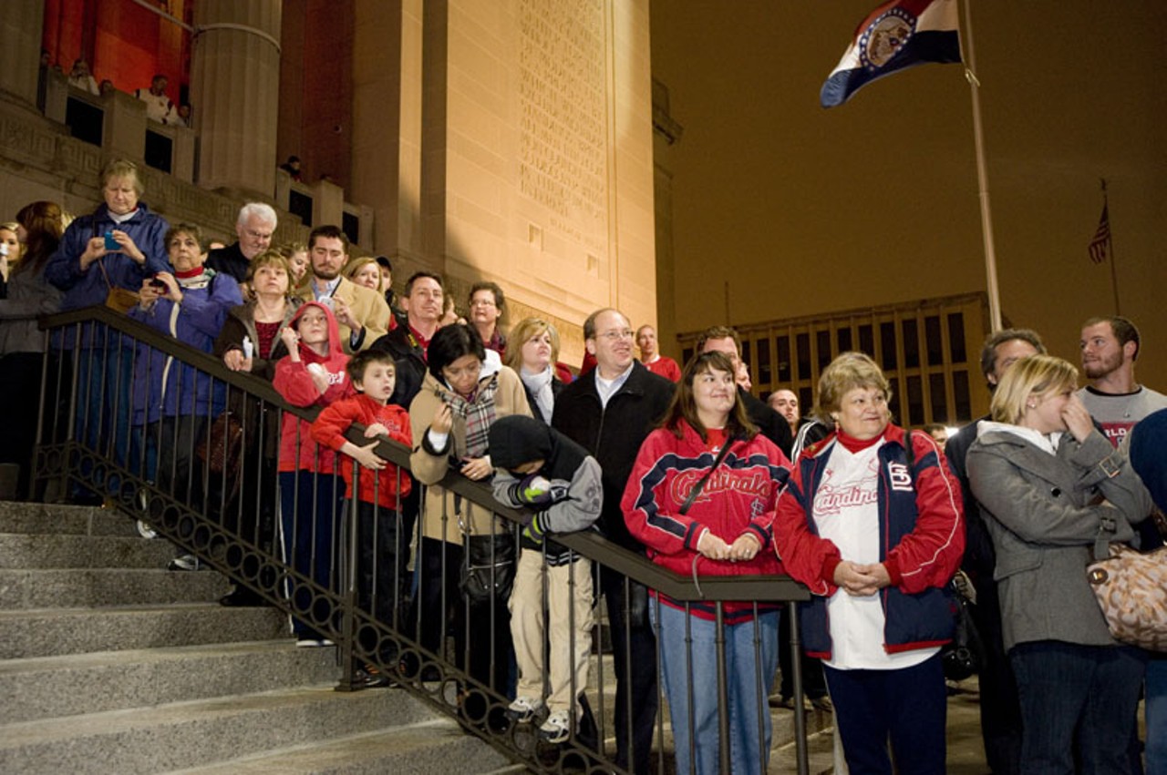 Cardinals fans awaiting the arrival of any high-profile guests to make appearances at the 2011 World Series DVD premiere screening at the Peabody Opera House on Tuesday night. NLCS and World Series MVP David Freese, relief pitcher Kyle McClellan, Cardinals radio announcers Mike Shannon and John Rooney, St. Louis Mayor Francis Slay and St. Louis County Executive Charlie Dooley were among those in attendance.