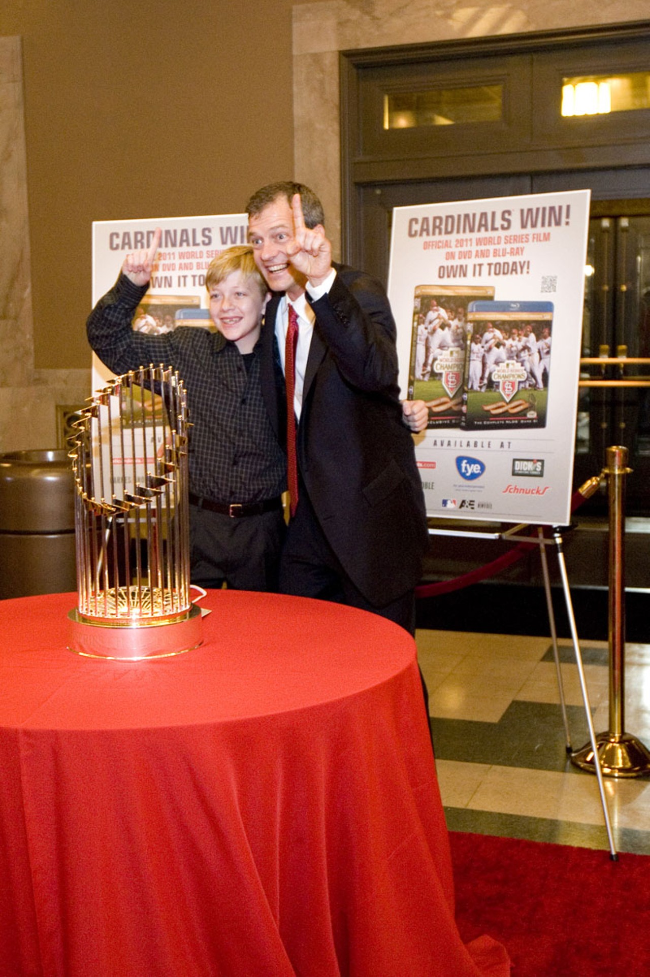 Cardinals VIP, family and friends would stop to pose with the World Series trophy on their way inside the Peabody Opera House Tuesday night.