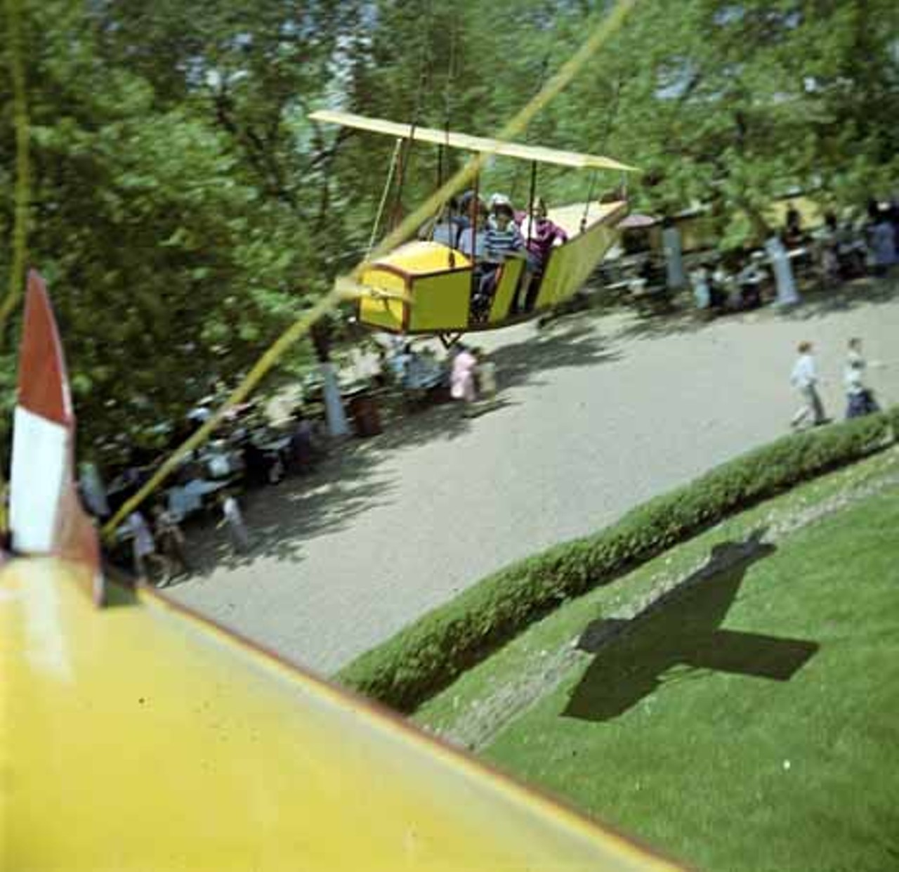 1947. Patrons take a spin on the bi-plane ride.
