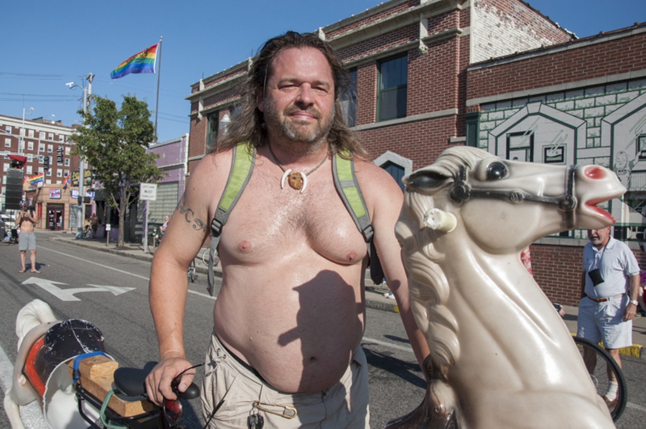 Benjamin Thomas standing by his steed at the 2015 World Naked Bike Ride.
