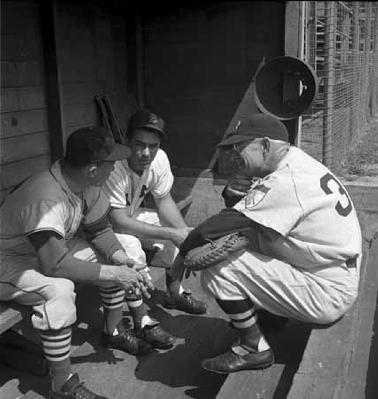 1952. Manager Eddie Stanky with two Boston Red Sox coaches at St. Louis Cardinals spring training in St. Petersburg, Florida.