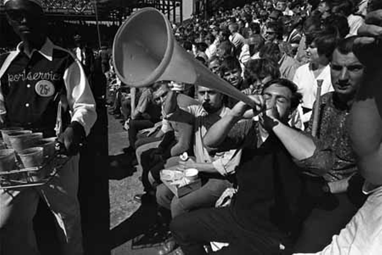 1964. Spectators with noisemakers at a World Series game at Sportsman's Park.