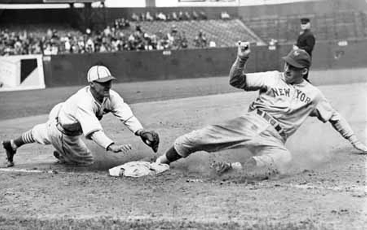 1938. St. Louis Cardinals third baseman Joe Stripp is ready for the slide from New York Giants catcher Harry Danning.