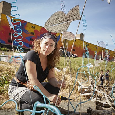 Carrie Goodson works on her sculpture "Fish out of Water."