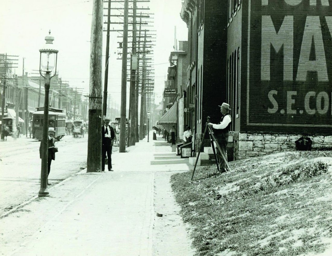 Surveyor at work at 1219 Franklin Street. Photograph, 1910.