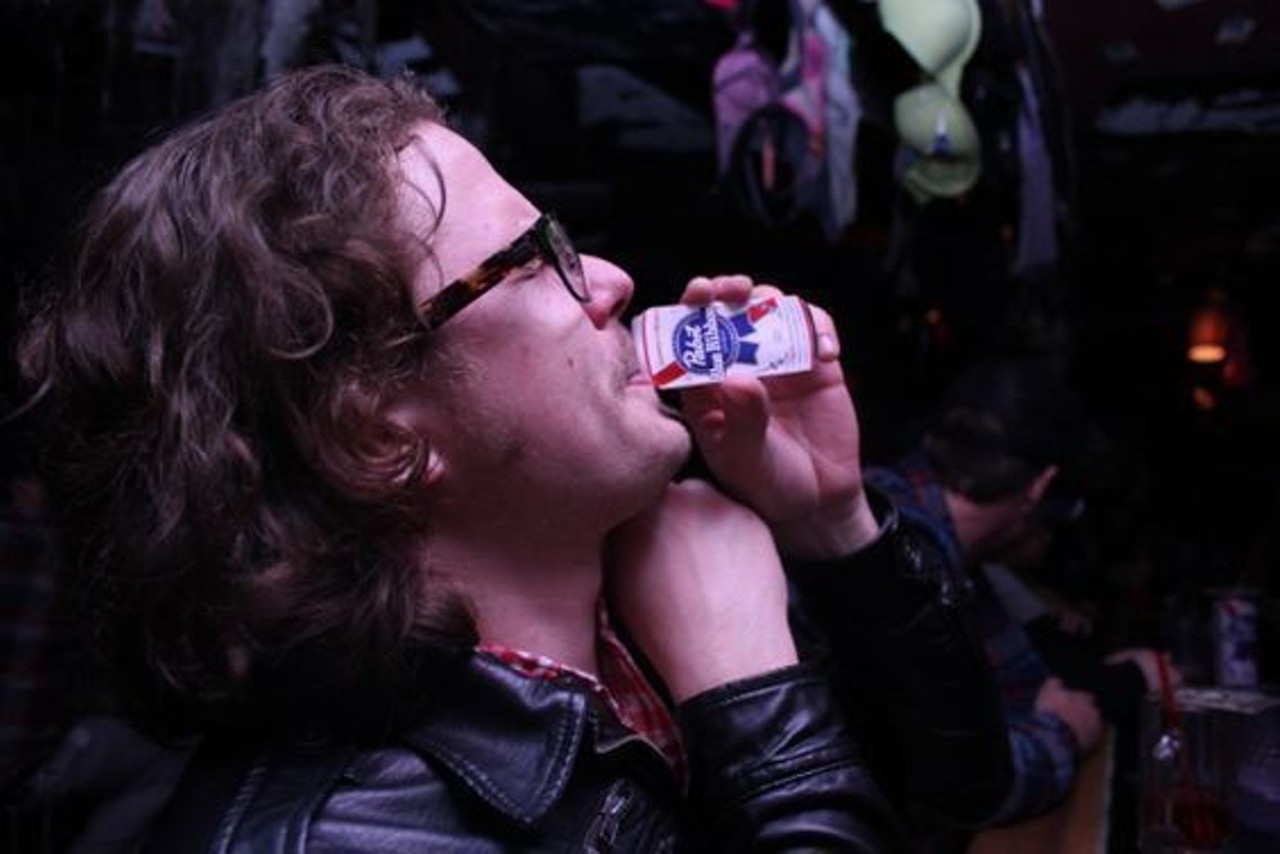 This guy drinking the smallest Pabst Blue Ribbon we've ever seen