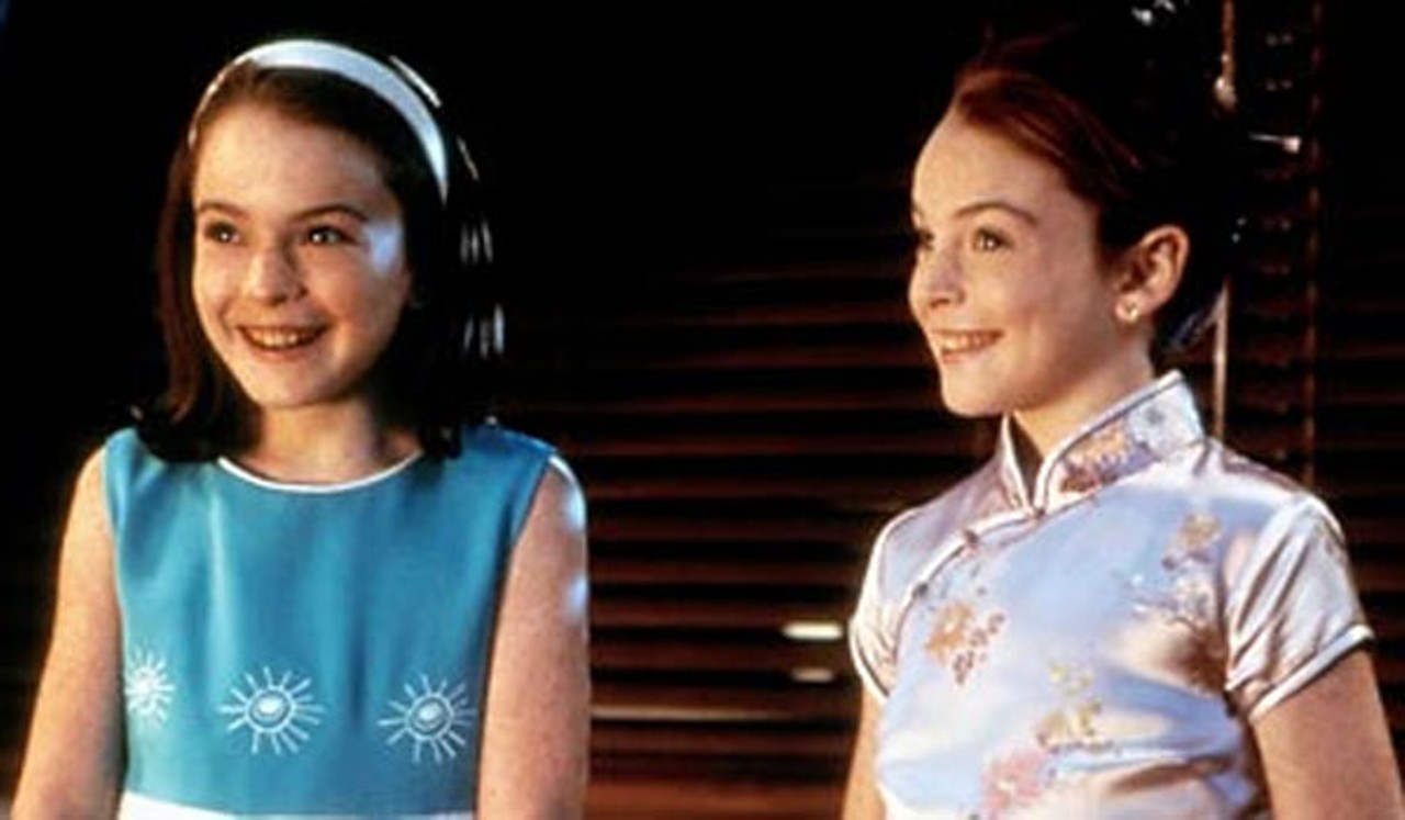 Lohan as a child, playing identical twins in the 1998 remake of Disney's The Parent Trap.