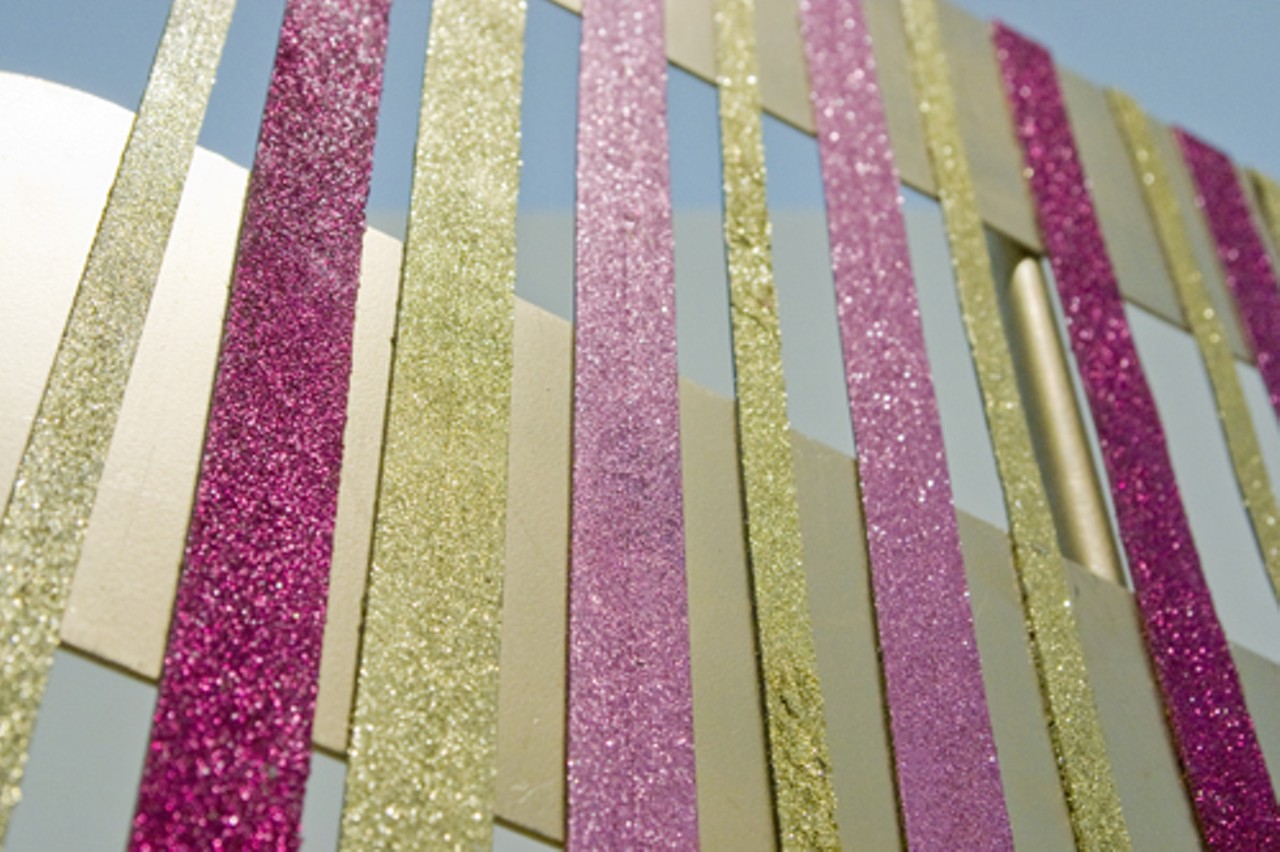 Could this strips of glitter be affixed to street sign poles?
