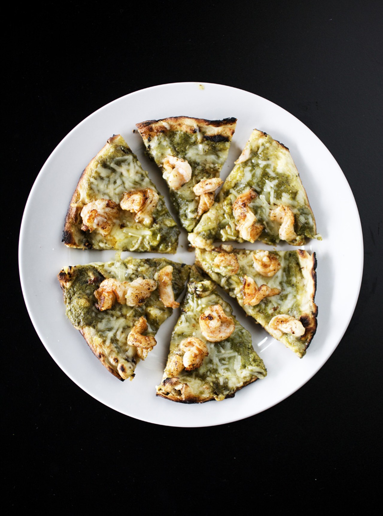 The Shrimp Flatbread, one of the appetizers on the menu, is southwest spiced shrimp with pecan cilantro pesto, roasted garlic and cheese blend on grilled flatbread.