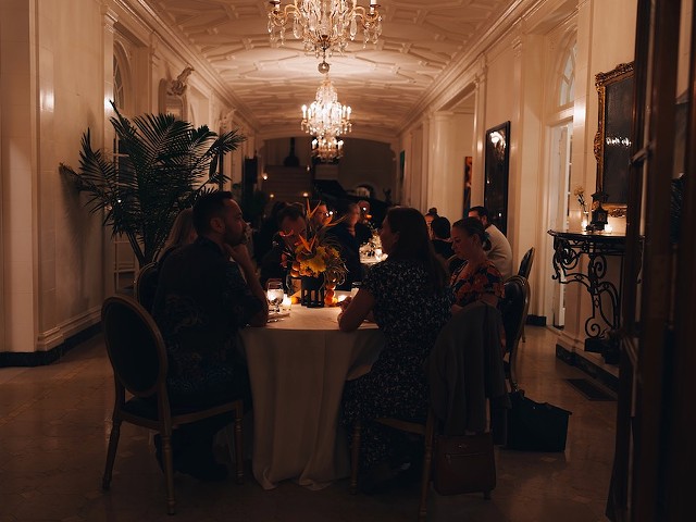 The dinner party convened in a Central West End mansion's 65-foot hallway.