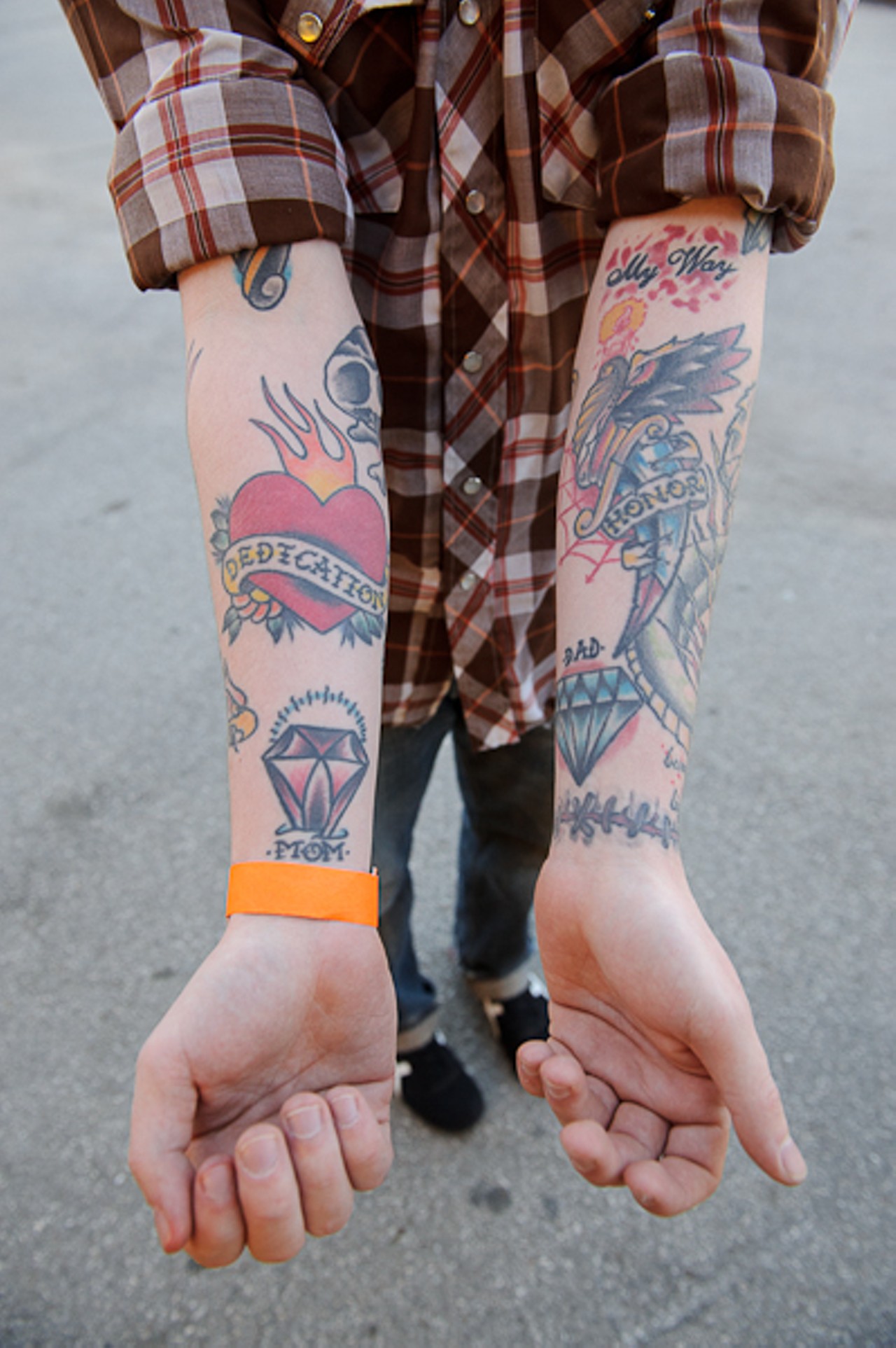 A Bronx fan shows off his tattooed-up forearms in the parking lot outside Pop's in Sauget, Illinois, before going inside to see the band perform on April 10. Read The Bronx concert review here. and See more photos from the Bronx/Mariachi El Bronx show at Pop's here.