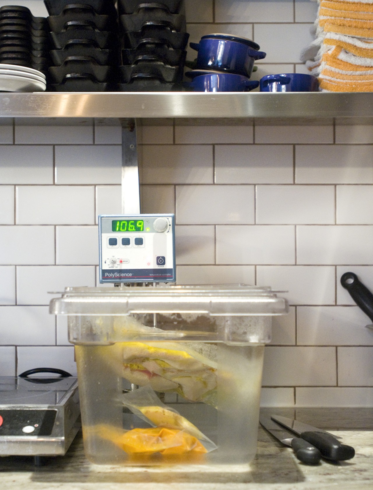 The immersion circulator got its start in science labs, but was later brought into the kitchen as a way to evenly cook and maintain exact temperatures by placing vacuum-sealed food in a water bath at an exact and desired temperature. This process is called "sous-vide," which means, "under vacuum." In addition to its precision, chef Gerard Craft also likes it for its space-saving dimensions.