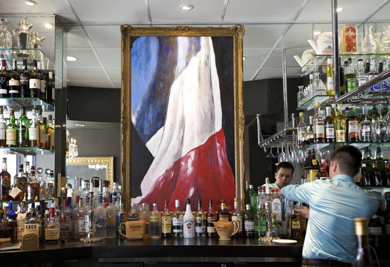 A painting of the French Flag &ldquo;flies&rdquo; above the bar at Chez Leon, now in Clayton, Missouri.