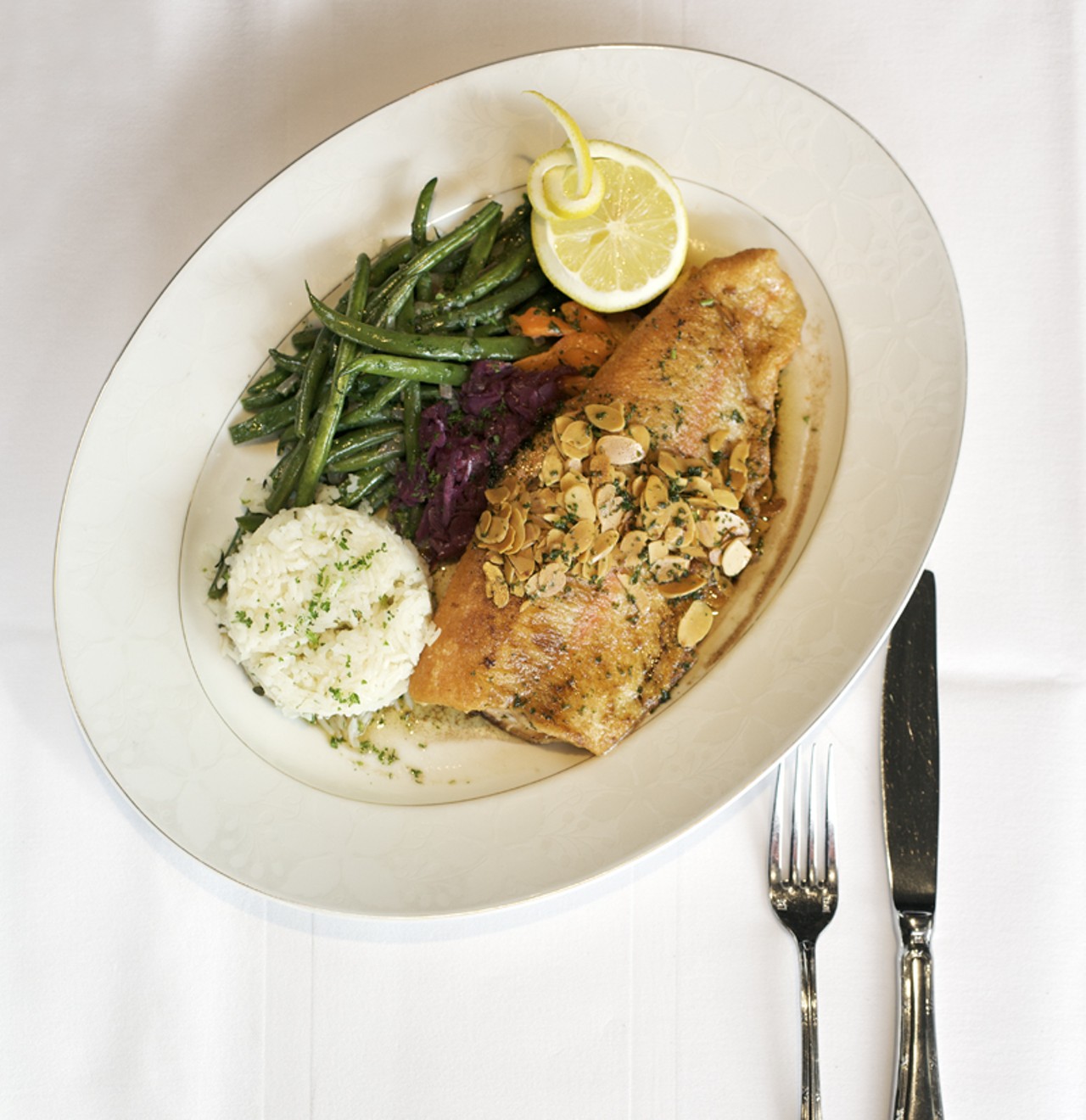 Truite &acirc;ux amandes is golden Idaho trout with haricots verts, braised red cabbage and rice pilaf.