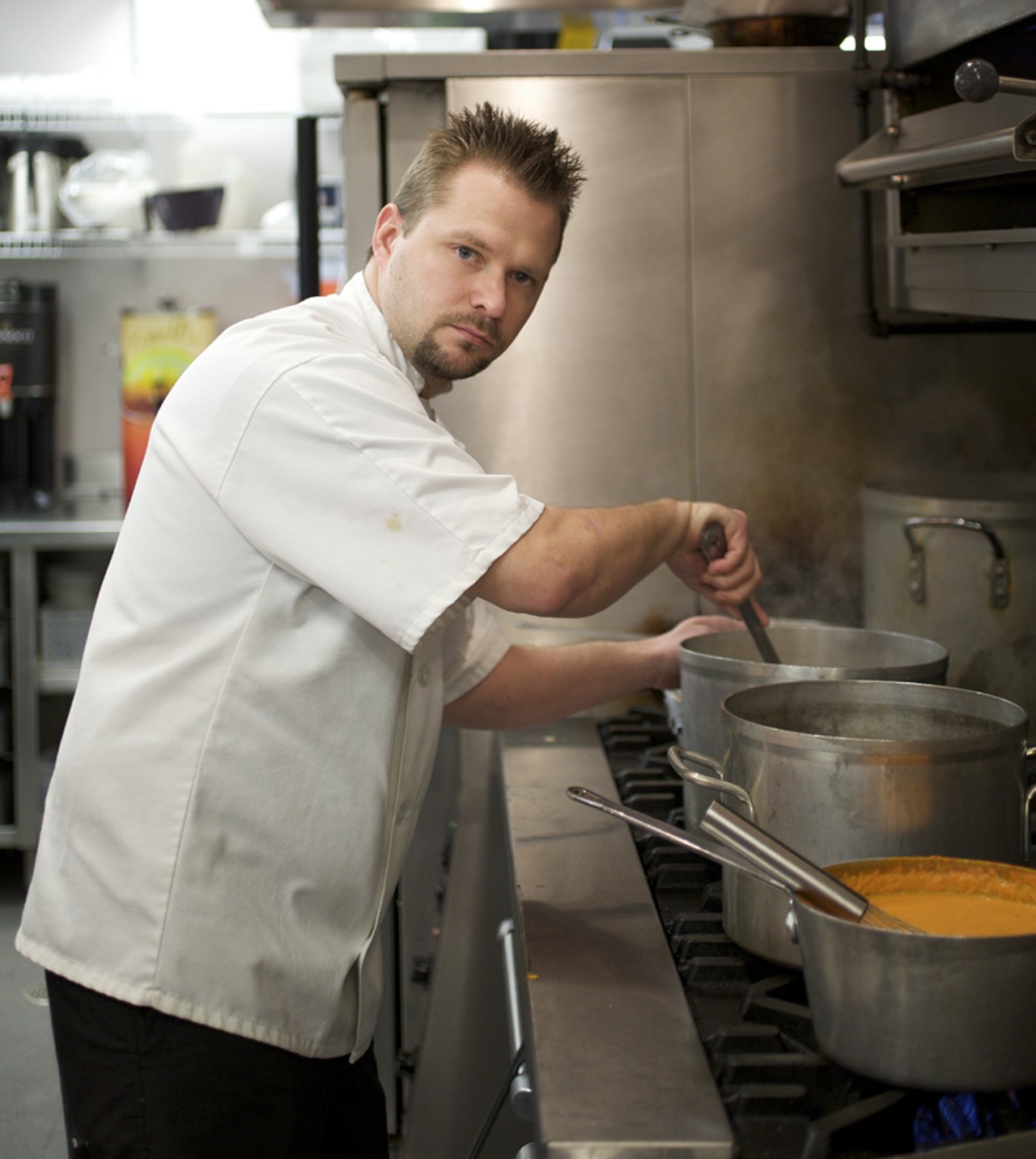Executive Chef John Buchanan checking on his soups and sauces before the evening crowd arrives.