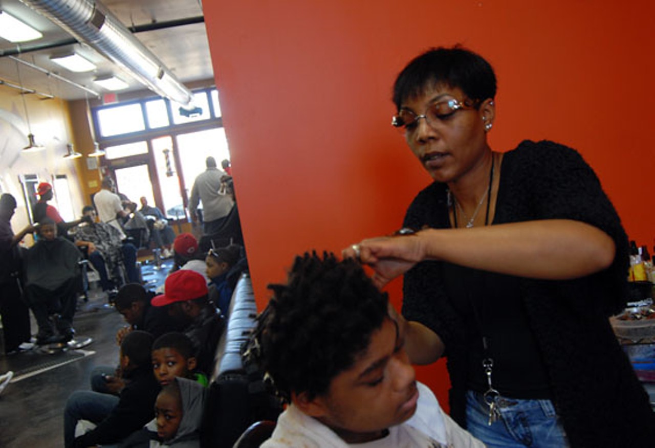 Dawn Causey, owner of Tayler-Made Barber Shop, works on a style. She opened the shop at 5888 Delmar Boulevard in December 2007.