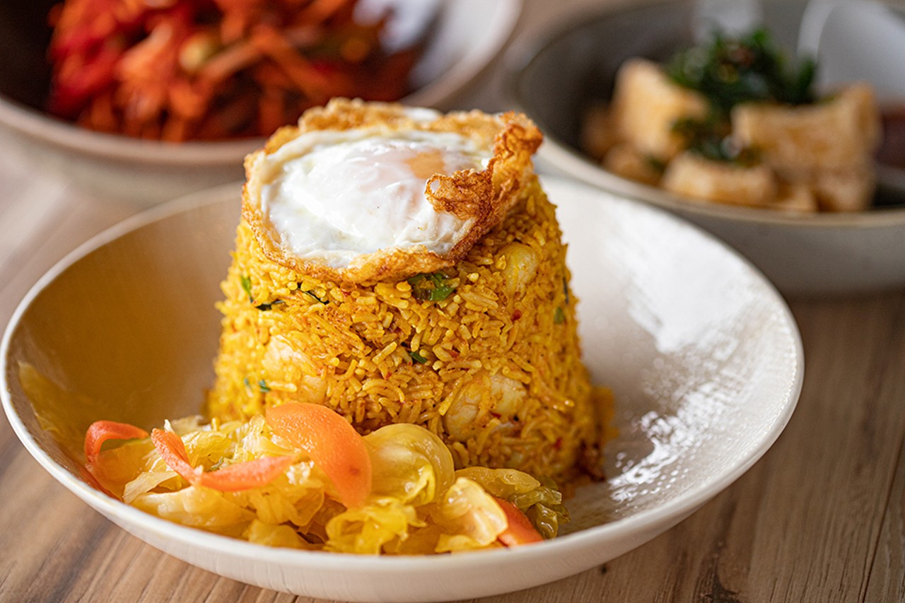 Nasi goreng, or Indonesian-style fried rice with shrimp, tofu, green onions, fried egg and pickled veggies.