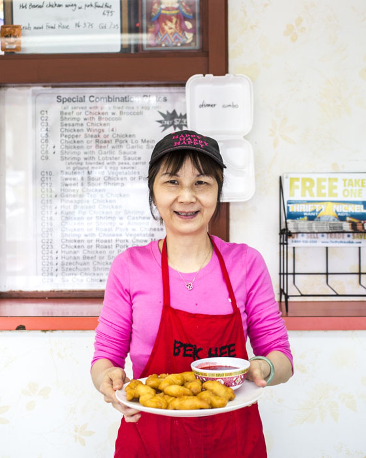 Jin Lian, the matriarch of this family-owned business, brings out an order of sweet and sour chicken.