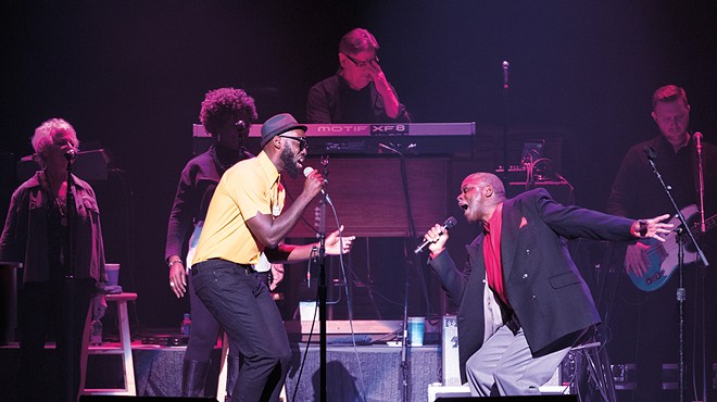 Brian Owens (left) performs on stage with his father, Thomas.