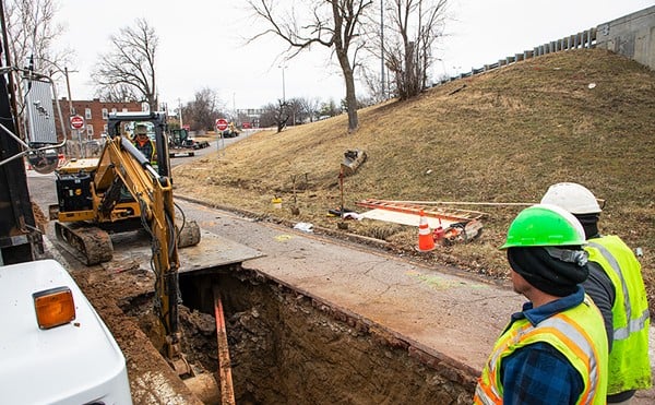 MoDOT crews work to repair a sinkhole that formed at the intersection of Bates Avenue and Interstate 55 on Tuesday, Jan. 30, 2024.