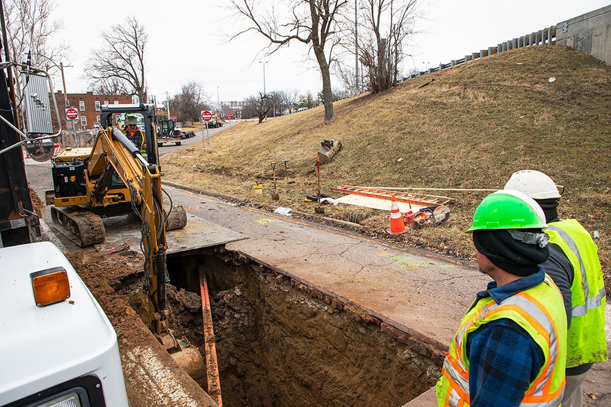 MoDOT crews work to repair a sinkhole that formed at the intersection of Bates Avenue and Interstate 55 on Tuesday, Jan. 30, 2024.