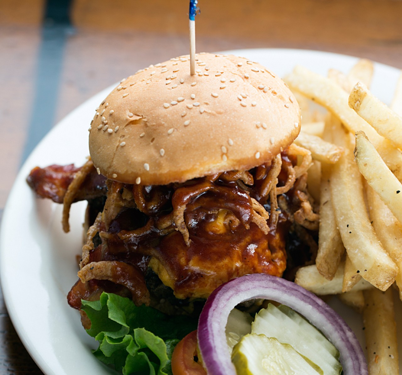 The "Smokehouse Burger" is a half-pound patty topped with soft cheddar, Billy's barbecue  sauce, bacon and onion straws on a butter kaiser roll.
