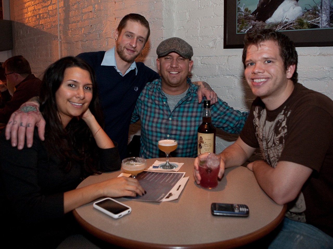 Mixologist Lucas Ramsey (center left) of Eclipse restaurant poses with friends.