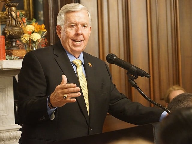 Mike Parson speaks from a podium.