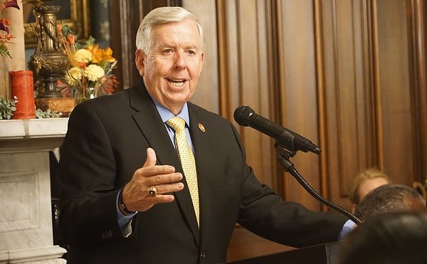Mike Parson speaks from a podium.